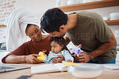 Buy stock photo Down syndrome, family and parents with toys for child, education and learning home kitchen. Mom, dad and baby together at table for playing, teaching and cognitive development in house in New York
