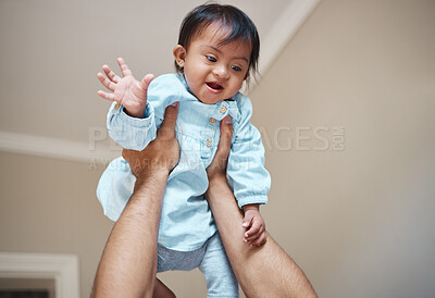 Buy stock photo Love, family and baby with down syndrome playing and having fun with father in a bedroom, bonding and relax together. Development, growth and curious girl with disability enjoy time with parent 