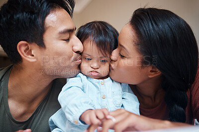 Buy stock photo Love, disability and down syndrome parents kiss special needs kid with appreciation. Mom, dad and disabled baby in Puerto Rico home with happy and caring family bonding together.

