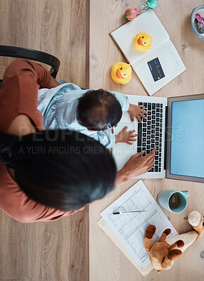 Buy stock photo top view, baby and mother working on a laptop at table at home while taking care of her child. Kid, technology and woman with remote job typing on a computer with documents for a project at her house