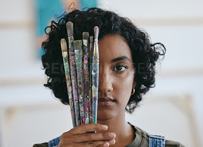 Buy stock photo Brush, portrait and woman is a creative painter in an art gallery or workshop studio for watercolor painting. Freedom, artist and Indian girl with paintbrushes for her craft, hobby and drawing talent