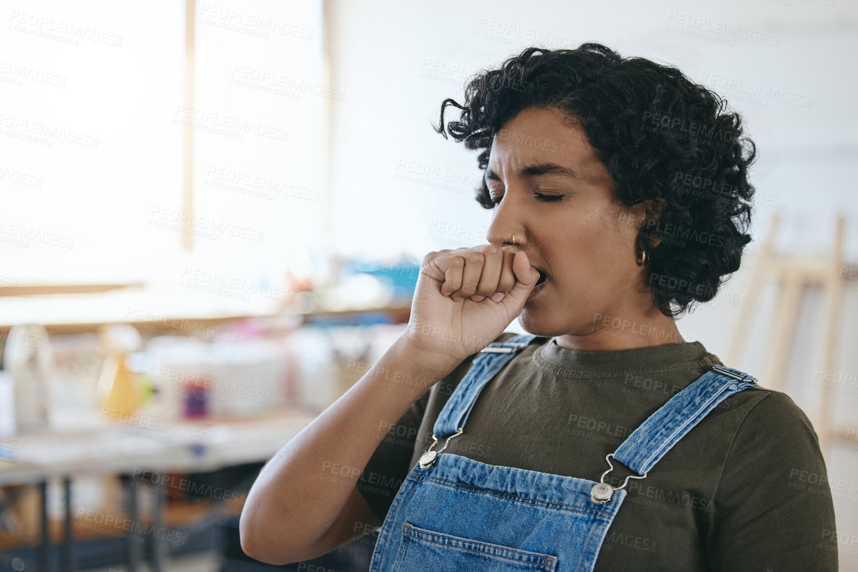 Buy stock photo Tired, art and painter yawning while working on a creative project at a studio. Face of a black woman, artist or girl with burnout and stress from creativity, painting design or fatigue at a workshop