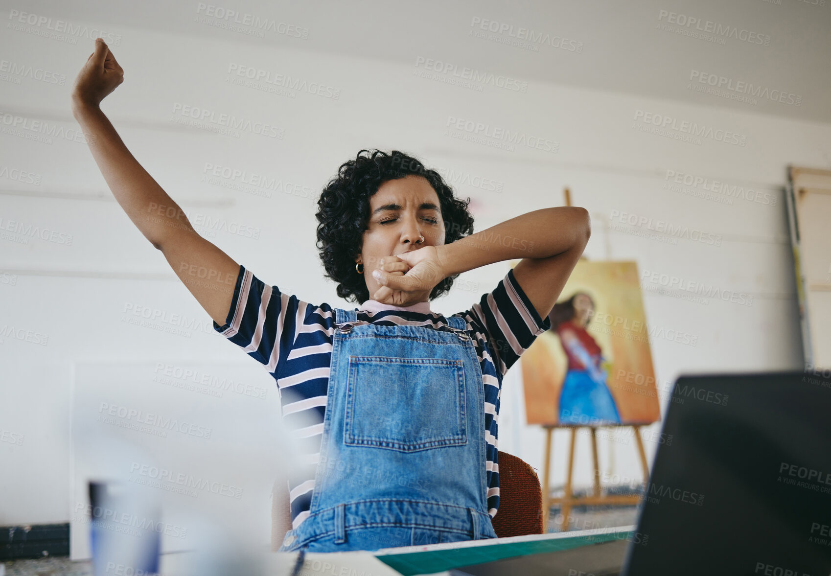 Buy stock photo Studio, art and tired painter stretching after working on artwork project. Young woman artist in workshop sleepy, yawn and an early morning stretch. Creative girl doing work on laptop in art studio