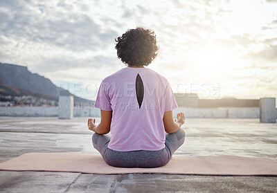 Buy stock photo Yoga, back view and woman in meditation on roof training to meditate body and spiritual mind in Cape Town city. Fitness, wellness and zen girl in peaceful lotus pose for a relaxing exercise outdoors