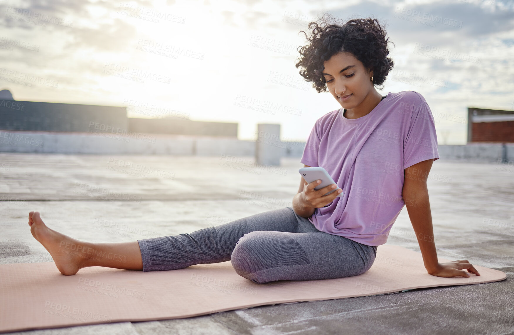 Buy stock photo Phone, yoga and woman browsing on social media while sitting on a mat on workout break outdoor. Fitness, communication and girl athlete networking on the internet with smartphone while doing exercise