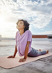 Yoga, stretching and woman training her body with focus in the morning in the city of Morocco. Girl doing meditation fitness exercise to relax, motivation and exercise for stress and mental health