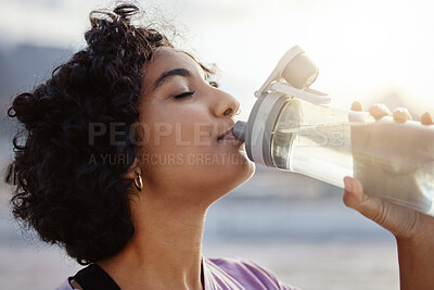 Buy stock photo Fitness, health and sports woman drinking water to hydrate, relax and healthy energy outdoors in summer. Tired thirsty girl refreshing liquid for hydration for training, workout and running exercise