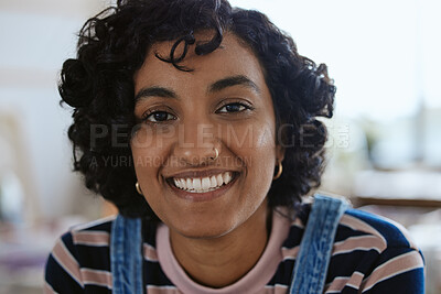 Buy stock photo Face, portrait and happy with a young woman feeling carefree or cheerful with a smile closeup. Head, teeth and nosering with an attractive, trendy or edgy female with a piercing on a blur background