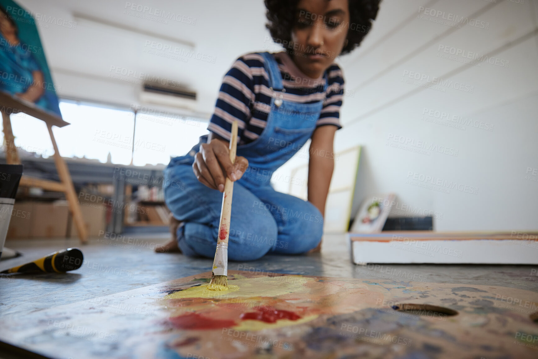 Buy stock photo Woman artist, painting and canvas on floor in art studio for creative exhibition, design academy and students home workshop, school or gallery. Designer, watercolor painter and brush stroke project