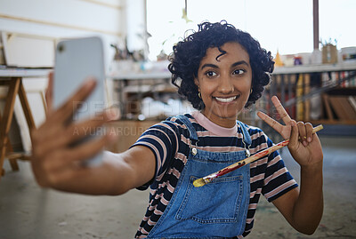 Buy stock photo Indian woman artist, selfie with paint brush and art on floor of studio workshop to share to social media. Portrait of happy, creative professional painter and smiling after oil or watercolor project