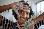 Creative portrait, hands with paint on happy art school student and oil painting inspiration for Indian woman. Fun learning color theory and young artist creativity in university workshop studio 