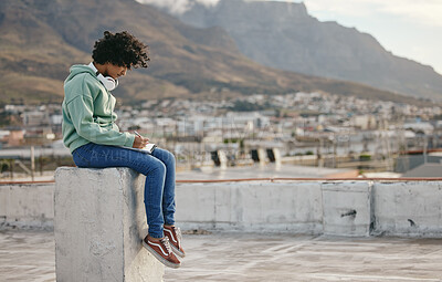 Buy stock photo Freedom, book and writing girl on outdoor rooftop for diary inspiration, motivation and peace on Cape town roof building. Pen, notebook and relax for young gen z woman, artist or creative journal
