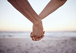 Love couple holding hands, beach and care together at ocean, nature and summer vacation of save the date in Maldives together. Closeup man, relax woman and support, trust or hope on honeymoon holiday