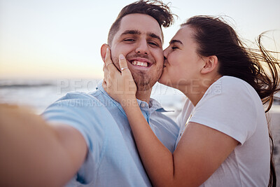 Buy stock photo Selfie, beach and couple with kiss during holiday for love at beach in Australia after marriage in summer. Portrait of man and woman live streaming on social media with affection at sea for vacation