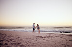 Beach, sunset and beach couple on date holding hands in summer, outdoor holiday or vacation with sand and sky mockup. Love, care and travel people, man and woman by sea, horizon mock up background