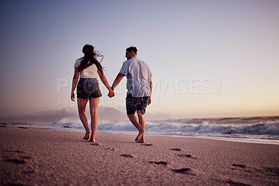 Buy stock photo Love, holding hands and couple walking on the beach relax, bond and enjoy romantic quality time together in Israel. Peace, freedom and ocean air for man and woman on sea sand travel for wellness calm