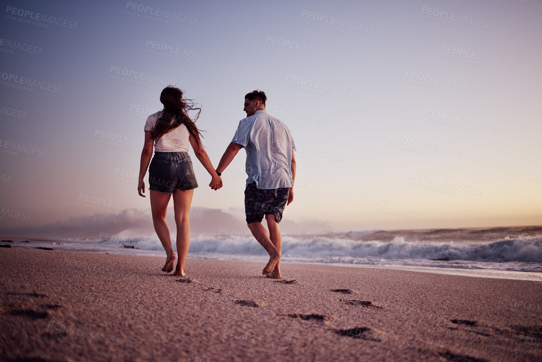 Buy stock photo Love, holding hands and couple walking on the beach relax, bond and enjoy romantic quality time together in Israel. Peace, freedom and ocean air for man and woman on sea sand travel for wellness calm