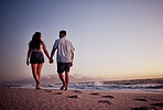 Couple, hand and love for beach walk together in romantic summer break in the outdoors. Man and woman holding hands while walking on a beautiful ocean coast in romance for vacation in Costa Rica