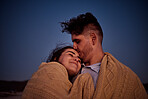 Sky, stars and couple with blanket at night, enjoying the evening together. Young man and woman in relationship bond in star gazing, camping and cuddling. Travel, peace and people in love on holiday
