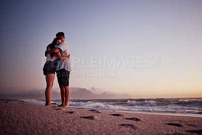 Buy stock photo Love, beach and footprints in the sand with couple at sunset for support, hug or happy on Cancun summer vacation. Trust, goals and hope with man and woman by the sea on holiday for travel and romance