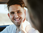 Couple, man and face touch in car with girlfriend for gratitude and care on road trip together. Woman touching cheek of boyfriend with smile for happy and intimate moment on travel holiday. 

