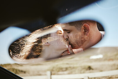 Buy stock photo Kiss, mirror and couple on a road trip for holiday during marriage together. Young man and woman with love and affection going on vacation in Mexico and kissing while on a calm drive in nature