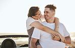 Couple, love and road trip travel of people with a hug and smile in the sun and nature outdoor. Happy girlfriend and boyfriend with quality time and sunshine happiness on a relax break together