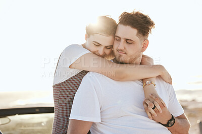 Buy stock photo Love, hug and relax couple on car for peace, freedom and sun on romantic road trip date for quality bonding time. Holiday, travel or calm young man and woman together with transport and sun flare