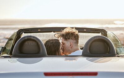 Buy stock photo Couple, love and kiss for travel in the sunset by the beach relaxing together and embracing relationship. Man and woman kissing in loving romance for bonding, traveling and road trip in the outdoors