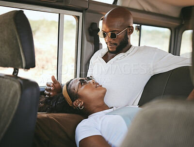 Buy stock photo Couple, car and travel in nature for road trip, vacation or holiday while relax in van. Man, black woman and transportation in countryside, safari or road for adventure, love and together in Kenya