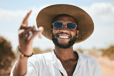 Buy stock photo Rock hand sign, black man and sunglasses stand on dirt road traveling, outdoor and adventure with cool hat. Portrait, African American male and smile on holiday, journey and countryside with style.