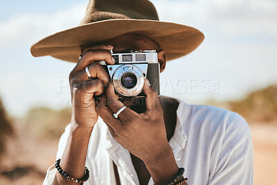 Buy stock photo Tourist, photographer and black man with camera to take photograph or pictures during travel adventure in summer on nature vacation. Closeup of male on photography trip holiday outdoors in safari