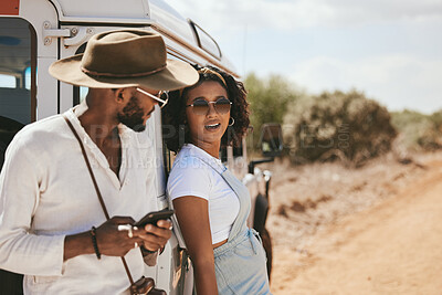 Buy stock photo Road trip, travel and black people with smartphone for safari guide app, location update and social media outdoor journey post with 5g network. Gen z couple with cellphone and caravan in countryside