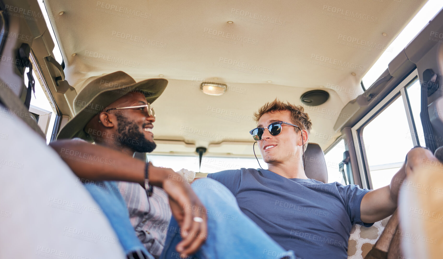 Buy stock photo Travel, road trip and men friends in conversation while sitting in caravan on summer holiday. Happy, smile and interracial people relaxing, talking and bonding while on vacation, journey or adventure