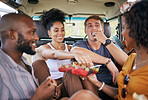 Diversity, fruit and friends on caravan road trip fruit while on holiday vacation eating watermelon, grapes and strawberry. Happy and hungry young men and women enjoying healthy fresh organic produce