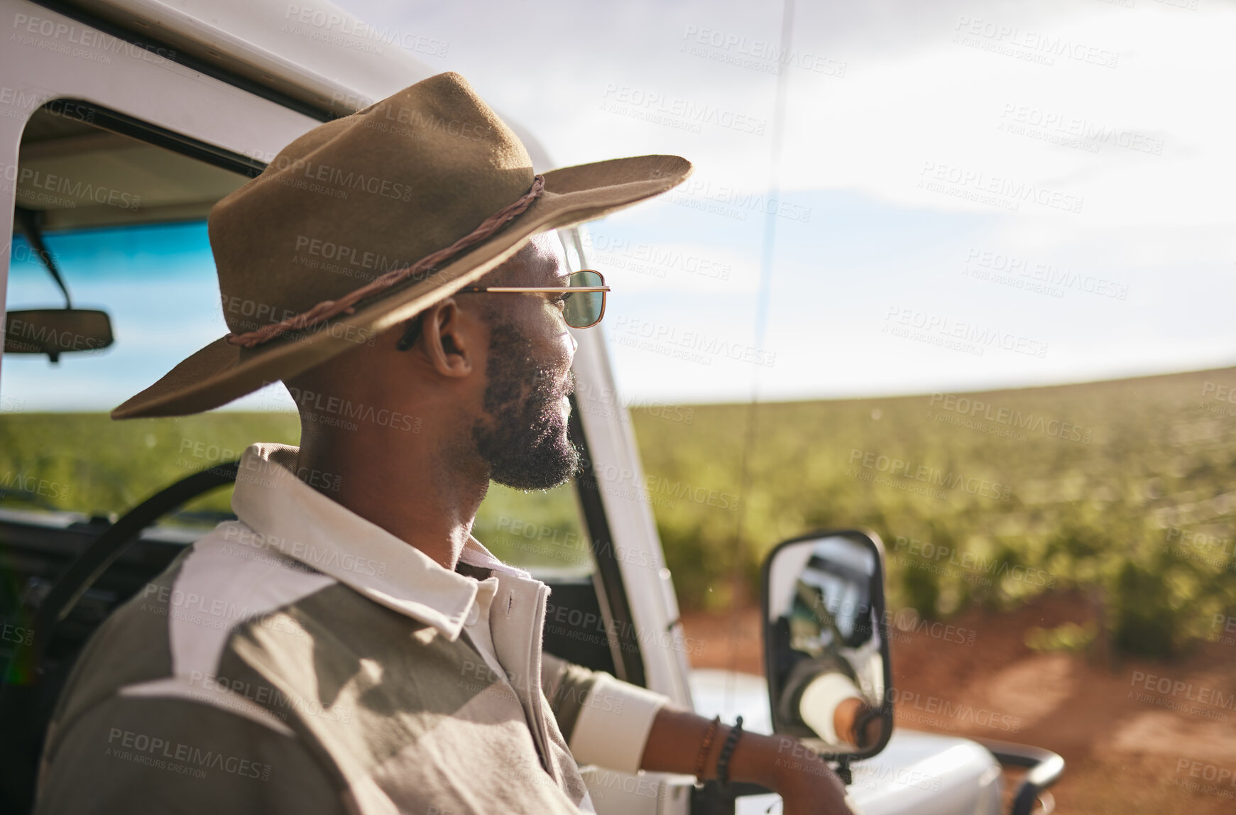 Buy stock photo Travel, road trip and a black man by a car for a holiday motor adventure. Calm and relax person looking at countryside nature taking a break from driving and transport outdoor in the summer sun