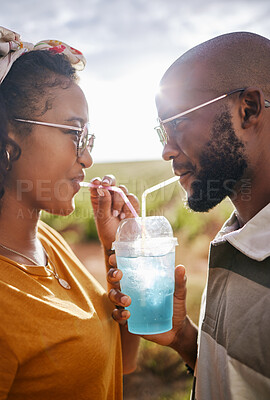 Buy stock photo Couple, drink and date with a black woman and man drinking a beverage while outdoor in nature during summer. Dating, romance and together with a boyfriend and girlfriend using a straw closeup