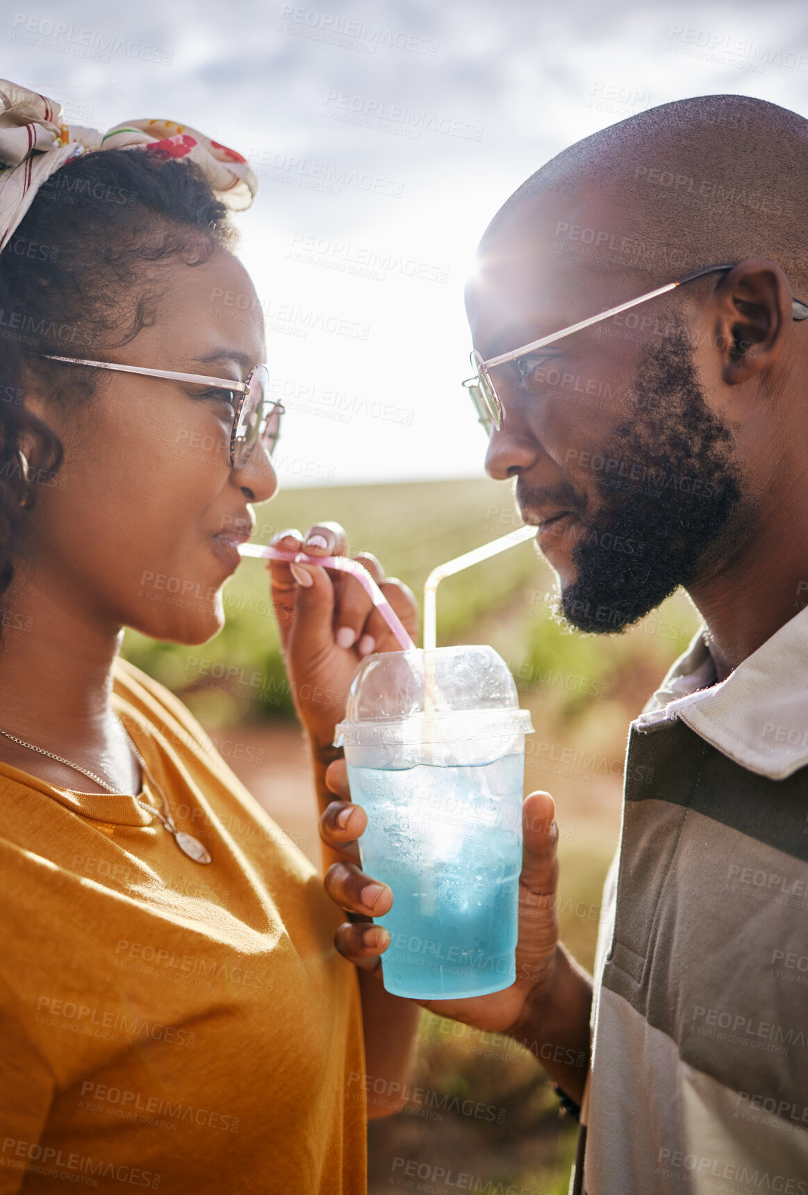 Buy stock photo Couple, drink and date with a black woman and man drinking a beverage while outdoor in nature during summer. Dating, romance and together with a boyfriend and girlfriend using a straw closeup