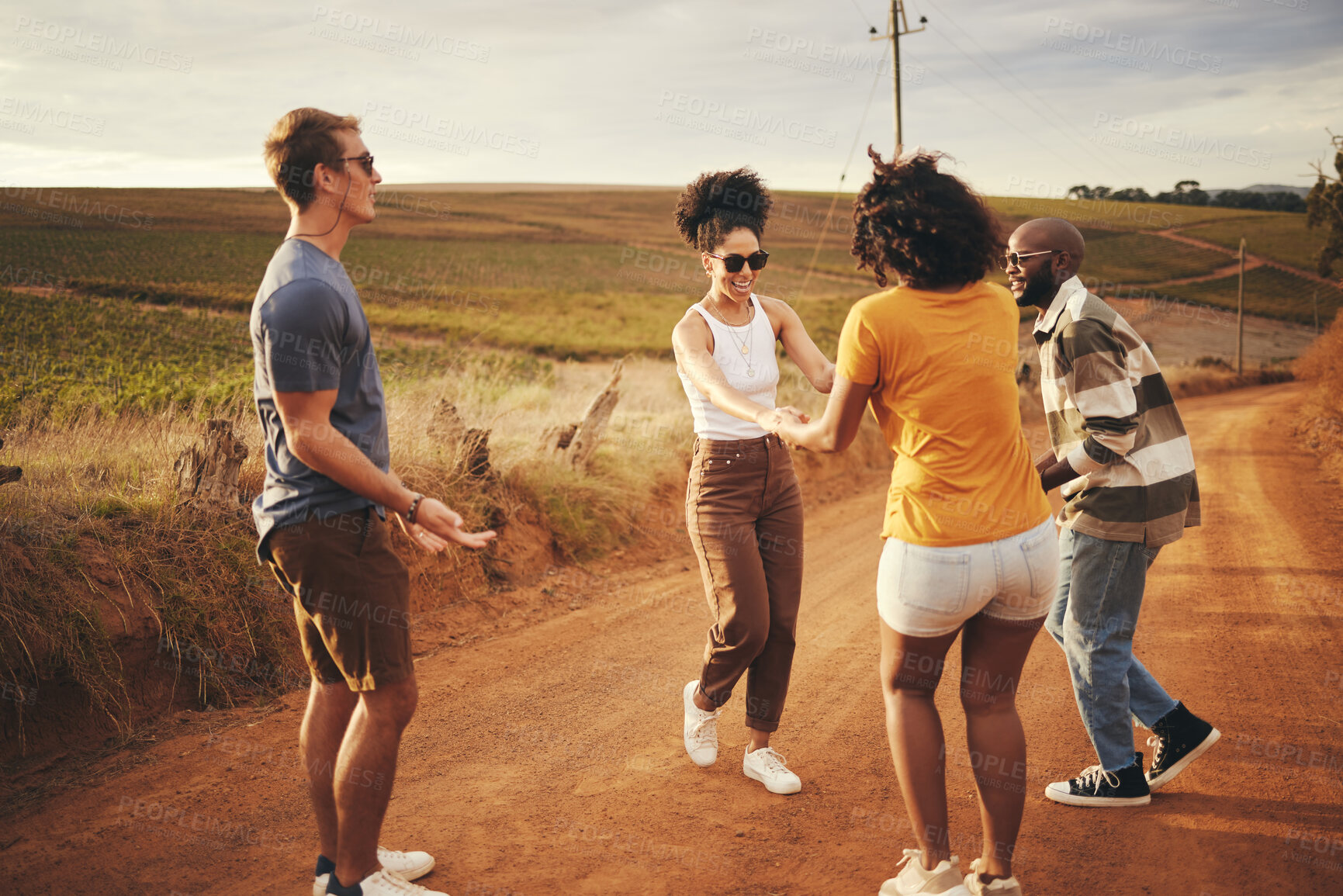 Buy stock photo Travel, friends road trip and happy free dance with diversity dancing together in a countryside. People having fun with quality time and positive traveler energy feeling freedom on a dirt trail