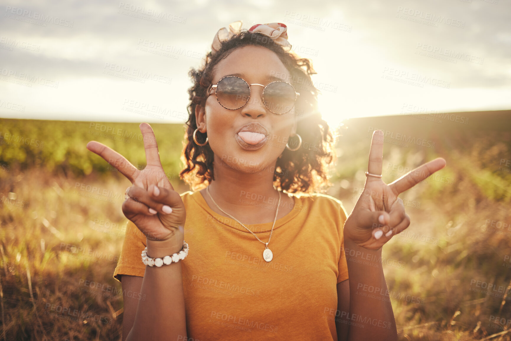 Buy stock photo Nature, freedom and peace hand sign by woman at sunset  in the countryside, happy and content while traveling, Portrait, grass and black woman having fun on road trip, taking break in rural landscape