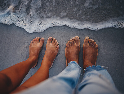 Buy stock photo Couple feet, beach sand and water at ocean waves, nature and summer travel for vacation, honeymoon date and tropical holiday outdoors. Closeup above man, woman and foot toes at sea, relax and freedom