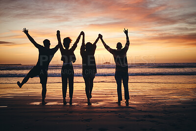 Buy stock photo Silhouette, sunset and friends holding hands at the beach on holiday in Miami during summer. Group of people with support, community and calm on a vacation by the water and sea for peace in nature