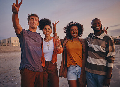 Buy stock photo Diversity, friends and on beach at sunset show peace, sign or relax together on holiday and vacation. Happy group, smile or on seaside getaway, trip or weekend break have fun, good time or travelling