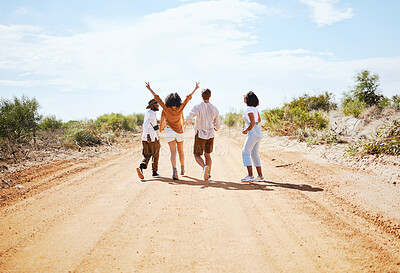 Buy stock photo Freedom, desert and friends walking outdoor in nature on a road trip vacation in the countryside. Travel, happy and group of people on outside dirt road adventure together on a holiday in Australia.