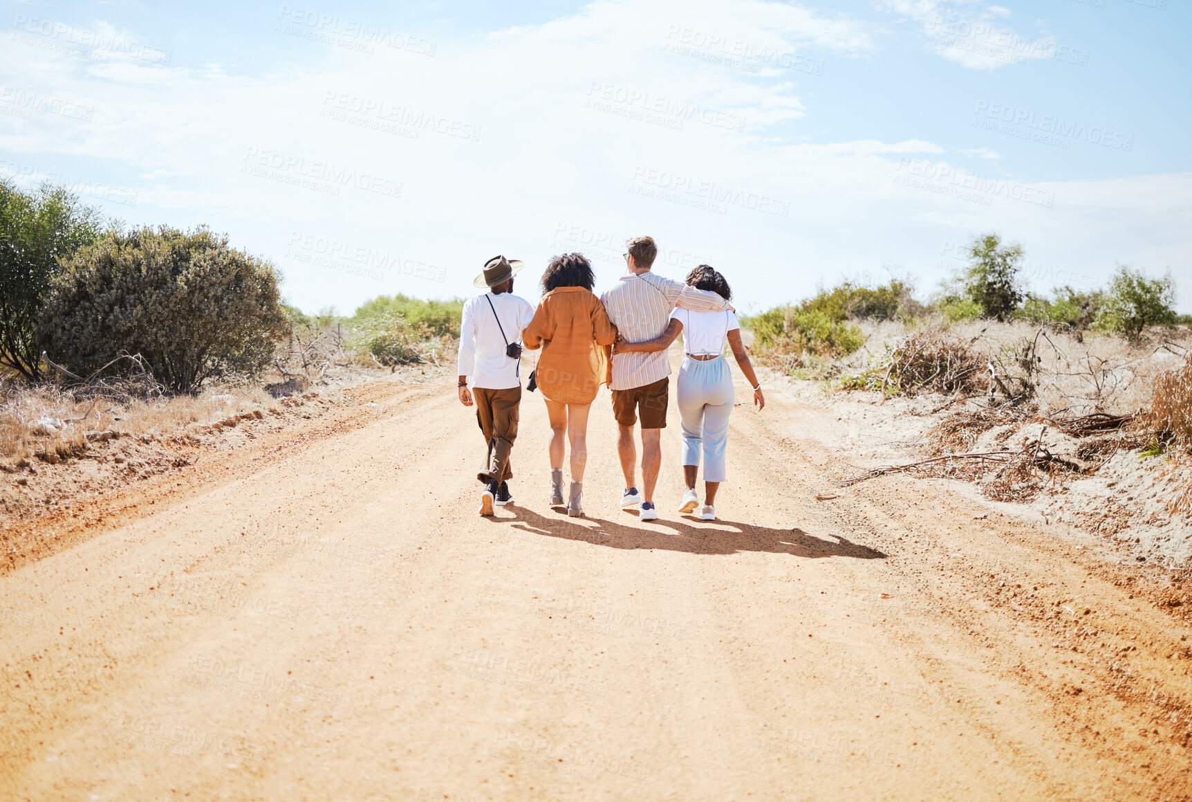 Buy stock photo Friends, hug and travel in the countryside for summer vacation enjoying time together in nature. People in friendship support, care and love hugging on a desert road or safari walking in South Africa