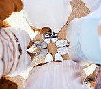 Friends, group and circle with shoes together for happiness, fun and bonding on holiday. People, sneakers and happy together with feet on sand in huddle while on travel, vacation or road trip
