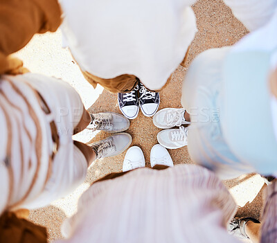 Buy stock photo Friends, group and circle with shoes together for happiness, solidarity and bonding on holiday. People, sneakers and happy together with feet on sand in fun huddle on travel, vacation or road trip