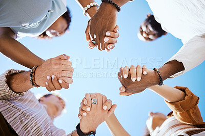 Buy stock photo Diversity, support and people holding hands in trust and unity for community against sky background. Hand of diverse group in solidarity for united team building collaboration and teamwork success