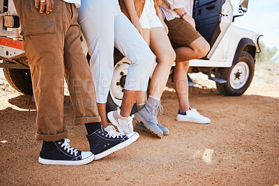 Buy stock photo Travel, shoes and friends bonding in road, standing together on a desert journey and taking a break. Adventure, fun and freedom by group of travellers exploring earth and stop to enjoy view together