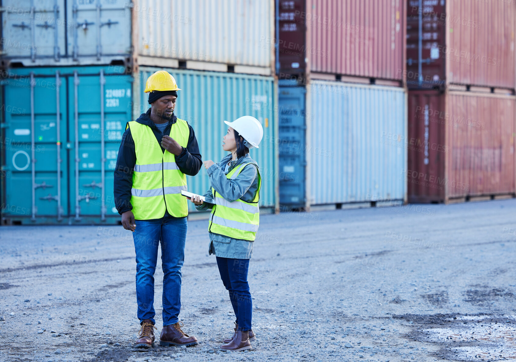 Buy stock photo Shipping, logistics and supply chain with a man and woman courier talking in a container port for distribution. Cargo, freight and service delivery with team at work in the stock and export industry